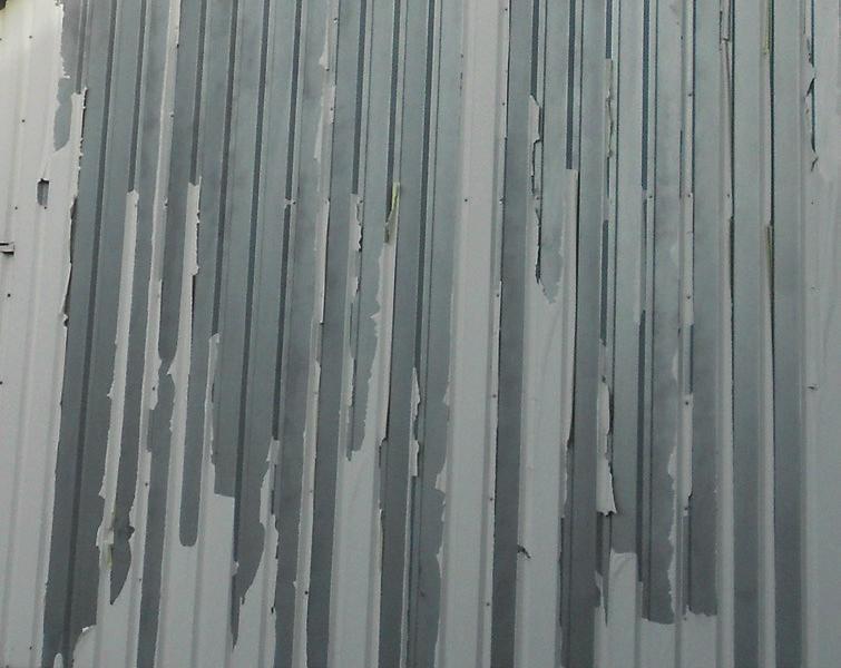 Delamination (Peeling, Flaking) > A loss of adhesion or separation of the paint film from the substrate. > Usually occurs around edges, trim or hardware.