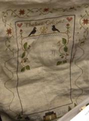 Needleworks ornaments; and a