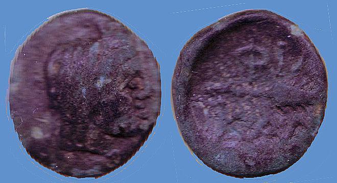2. 4.0641 g; 17 mm. The head covers nearly all of the face of the coin facing right, with no visible writing. The upper and back curves of the head are contiguous with the edge of the coin.