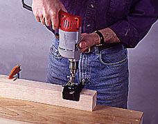 14-Use a doweling jig and drill to bore overlapping holes