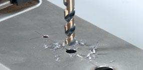 The hammering breaks up the masonry at the drill bit tip, and the rotating flutes carry away the dust.