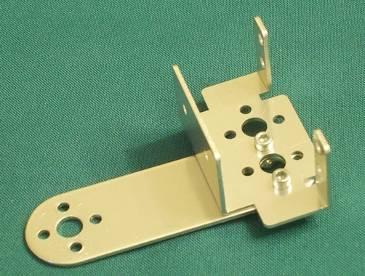 Assembly 8. Attach the servo bracket to one end of the flat bracket as shown, using 5/16" screws. 9.