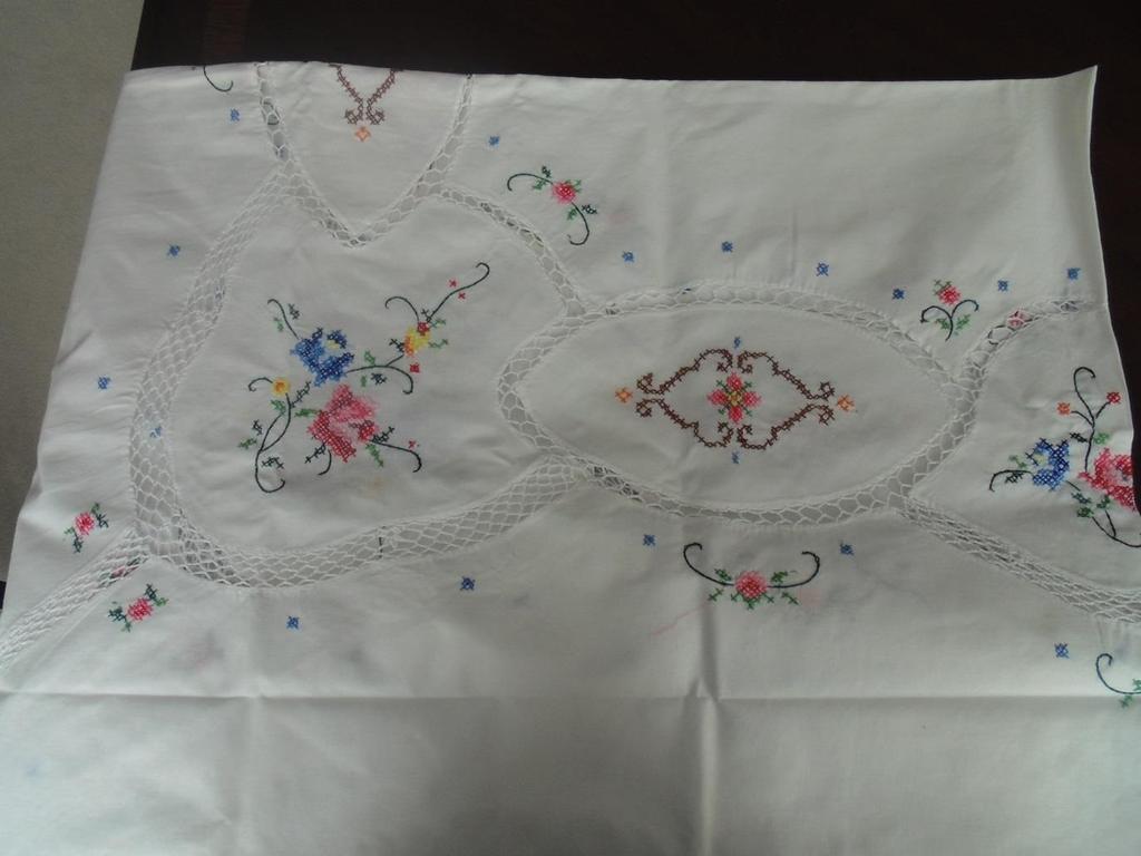 #33 Table Cloth Set This set of white table clothes is intricately embroidered