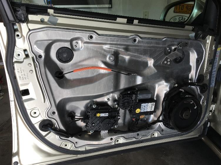 The door card should be free now, so set it aside. 10. Now you are looking at the interior aluminum panel.