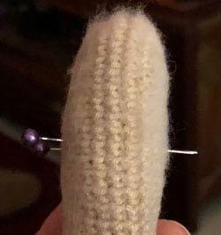 Now you have to shape the toes using brown yarn (or
