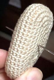 Run the thread over the foot and insert through at the first spot