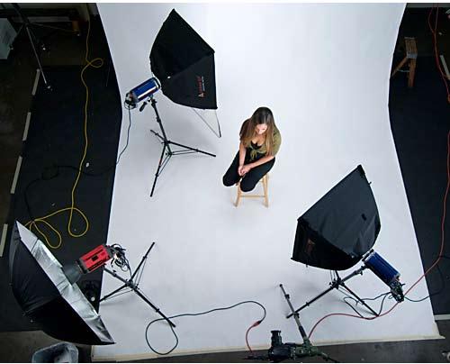 We placed another 650-watt strobe with softbox in the back of the set and aimed it at the background (figure 8).