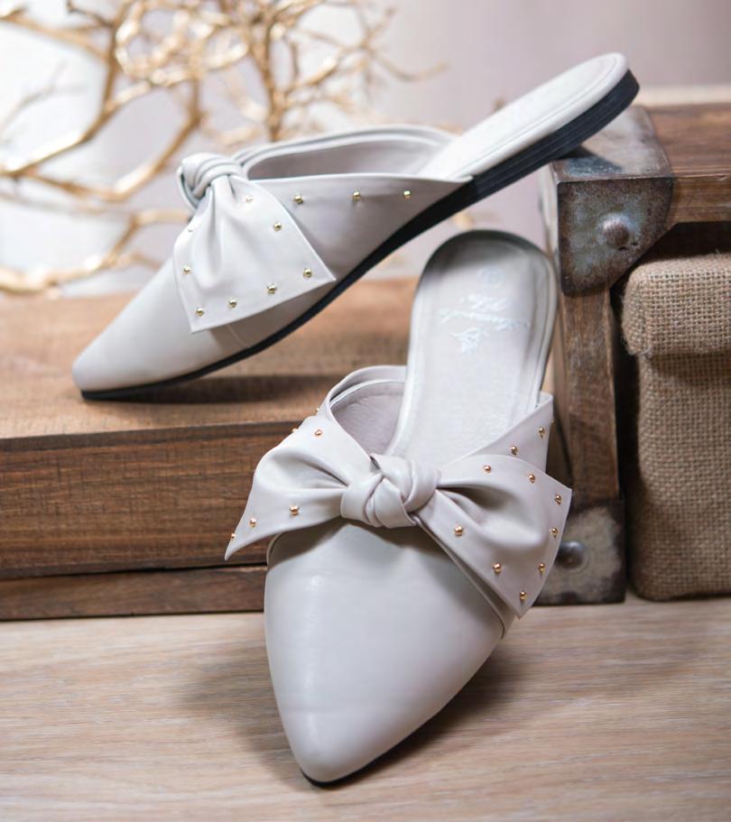 TINY GOLD STUDS ADORN THE BOW ON THESE GO-TO MULES FOR FALL. Studded Bow $17.50 each $157.