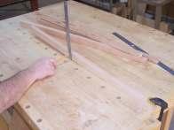 22. Hold the tapered end of the slides against that bench and measure from the bench to the top edge of the piece in
