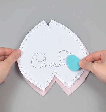 placement markings are, then carefully pull the paper pattern away while holding the applique piece in place.