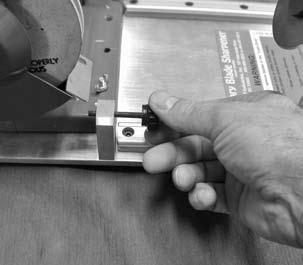 Sharpening a Rotary Blade A. Screw both stop screws all the way out. B. Put the slide assembly on the left hand track in the load/unload zone.