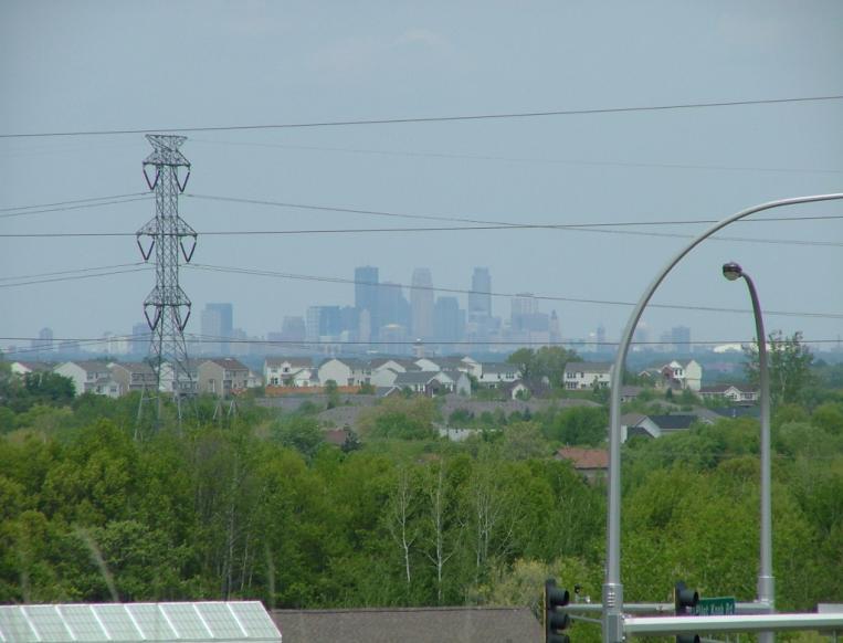 View from a roadside pulloff (left) that overlooks skyscrapers