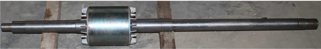 3) which is replaced by 1.8m long rotor as shown in Fig. 4. The shaft is supported by external bearings at both the ends. One backup bearing with 0.