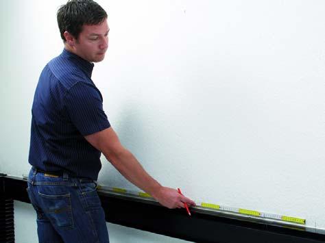 1 1) Begin by measuring the full wall width and mark the middle of the wall.