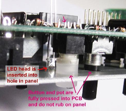 Step 10: Mounting part 2 A. Hold the unit so the panel is facing the floor. Gently guide the LEDs by their leads so their heads fit flush into their holes in the panel.