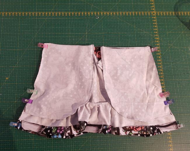 Waistband Fold waistband right sides together, short ends meeting up and sew.