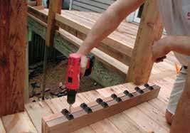 Structural support should come from either the continuation of deck support posts that extend up through the deck floor or from railing posts that are bolted to the inside of the rim or outer joist.