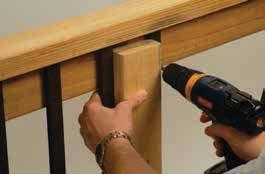 For posts set at 6' on-center, attach the first two balusters 2-1/4" on-center each side of the center line using four of the screws provided.