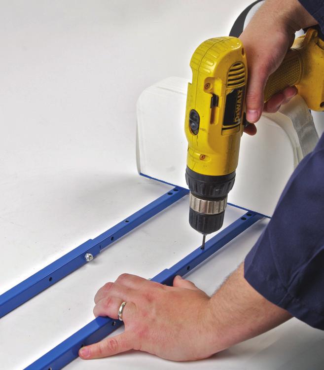 When this is accomplished, secure the two pieces together using the #10-32 machine screws and self-locking nuts in the two lower holes provided.