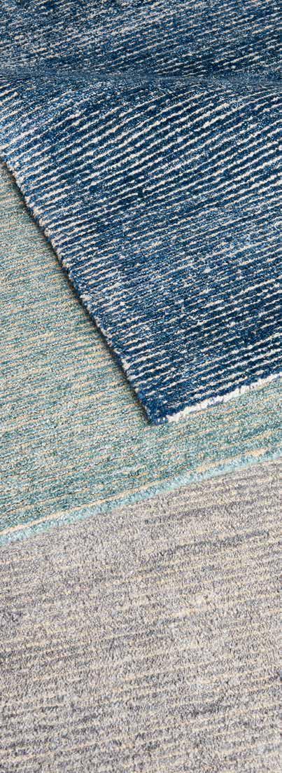 Hand tufted in a blend of jute and bamboo-extruded silk-like fiber, these area rugs are richly colorful, stylish, and designed for