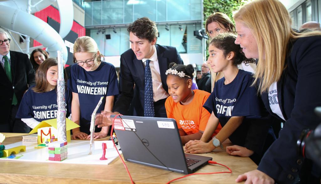 CHAPTER 5 INFLUENCE, COLLABORATION AND PARTNERSHIPS Prime Minister Justin Trudeau meets with elementary school students who spent the day designing the neighbourhood of the future at a workshop held