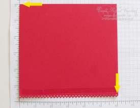 Red card stock with the border on the bottom and the adhesive side
