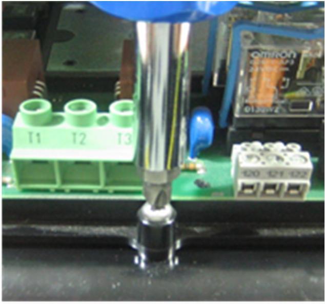 The photo in figure 3 shows the mounting holes for the rotation. The control board is held in place with one screw located at the bottom of the board in the center, just to the right of terminal L3.