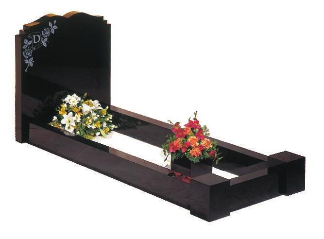 This has kerbs and two front vase posts with a hole for a flower container. Traditional kerbed memorials allow memorials to stand out against the array of more common headstones in a cemetery.