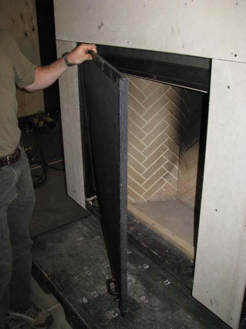 Step 3 Get a hold of the firescreen with both hands and bring it down. Slide the firescreen towards the left to disengage the right side from the right rail.