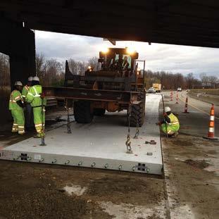 Figure 3.26. Placement of repair panels beneath an overpass on westbound Interstate 94 (Business Loop) near Kalamazoo, Mich. Figure 3.27.