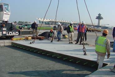 where precast panels have been used successfully to replace airfield taxiway paels are the 2002 LaGuardia Airport project in Queens, N.Y.