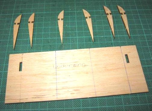 The wing struts are made from ¼ x 1/8 spruce / bass / etc. Cut out the three sections accurately to the plans and then glued them together over the plans. Make sure that both struts are the same.