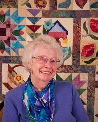 Ellie B. She started quilting because her daughter had a roommate in college who showed her a quilt.