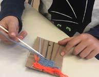 Second Grade Second grade students created fiber art with yarn on a cardboard loom. Students learned how to weave using the over-under-over-under method.