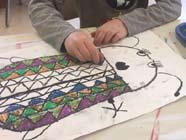 Students will draw one side of an insect using oil pastel, fold their paper in half, and and press down to reveal a mirror image of their drawing.