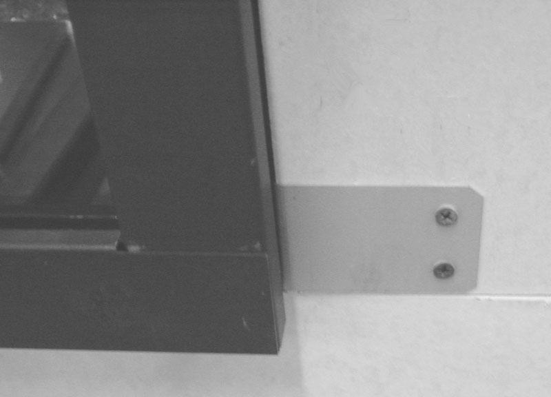 3 Repeat steps 1 and 2 for the bracket on the opposite side. 4 Repeat steps 1 and 2 to install a bracket at the center of the tile stop.