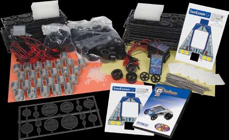 Each kit contains instructions, solar panel with alligator clamps, motor, wheels, steel axles, gear font, chassis parts, and a cut-and-fold cover.
