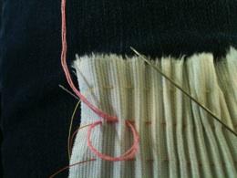 Go through the second pleat in the same manner.