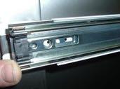 Install pull-out shelf slide to previously installed bracket by placing