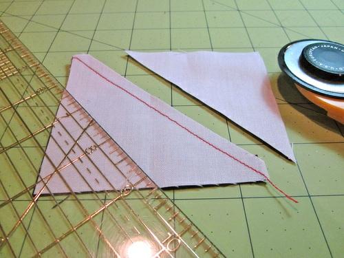 4. Press the seam. And, you get a half square triangle. Draw two lines 1.