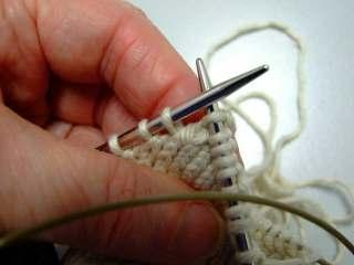 Slip it (knitwise), pick up SPR as in Fig E. Knit thru back loop; psso. Give your naked st a twist, return it to the LN; turn.