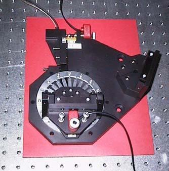 Two linear drivers are mounted on the base plate serially to drive the sine-bar. The rough adjustment is performed by a Picomotor TM [3] with a 20 nm to 30 nm step size.