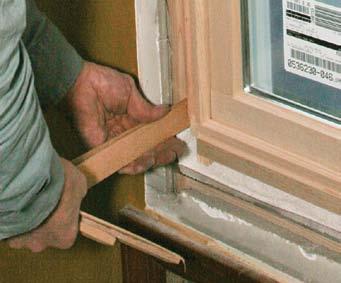 With the frame resting on the rough sill and centered in the rough opening, tilt the window slowly