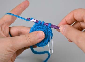 row. Bring the yarn over the hook from the back to the front.