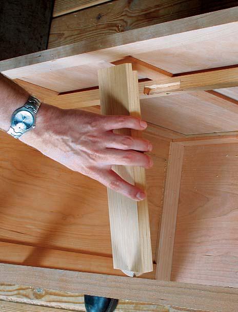 If the ball goes in the door, it will wear a groove in the cabinet frame that will be visible all of the time.