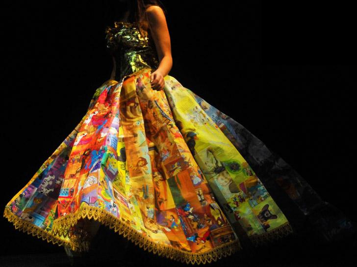 The paper skirt is comprised entirely of the original book illustrations sewn together with metallic gold thread.