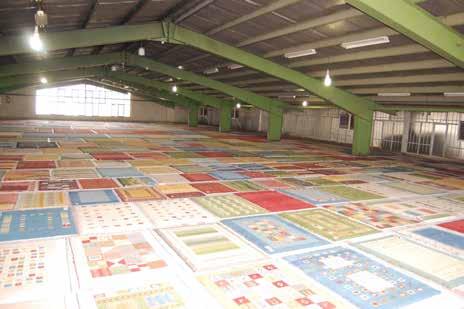 After a rug comes off the loom, it gets blocked to eliminate the curling sides and wrinkles are removed.