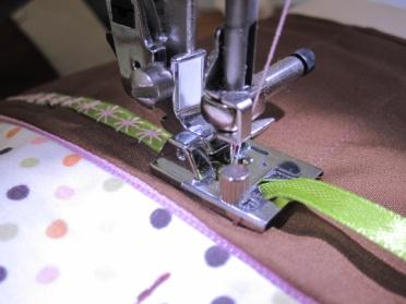 Trim any excess fabric. Place feet and accessories on your sewing roll and decide on pocket sizes.