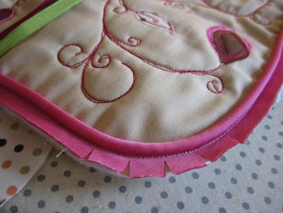 Round off the corners of your sewing roll layers using a mug or something round as a template. Make sure you don t cut your ribbon tail!