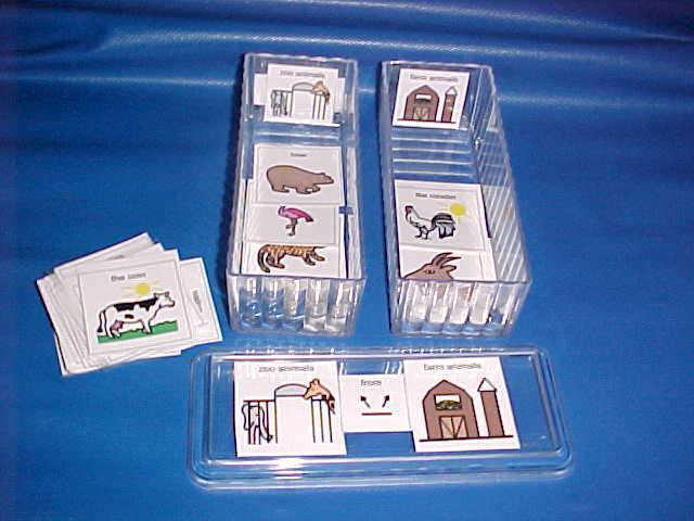 Sort zoo animals from farm animals. Created using: Mayer-Johnson Inc. Boardmaker, cardstock, laminating film and plastic butter dishes.